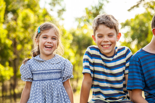 Portrait Of Children Laughing Together Outdoors