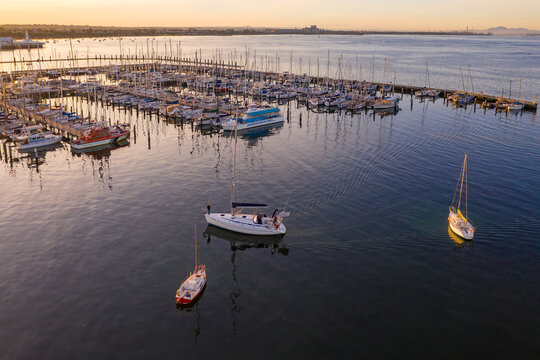 Aerial view of boats at a marina at sunset