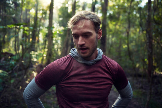 Male runner paused for a breather in the Woods