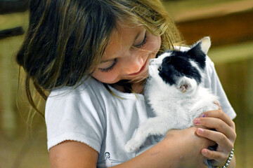 Love Between Child and Kitten