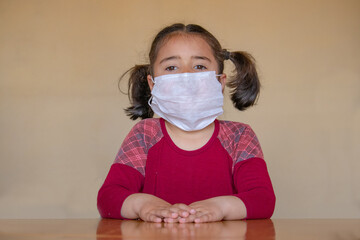 Girl with chinstrap mask coronavirus