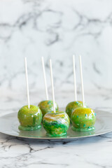 marbled green toffee candy apples on sticks