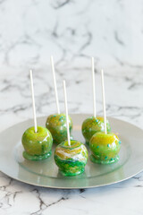 marbled green toffee candy apples on sticks