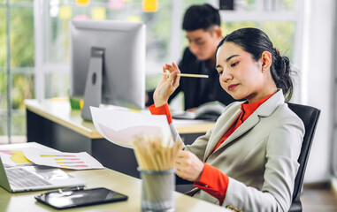 Business asian woman working with laptop computer.creative business people planning at modern work loft