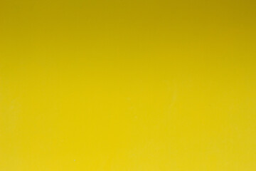 Obraz premium Yellow background with shadow on top