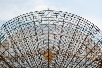 The large dish of a radio telescope abstract.
