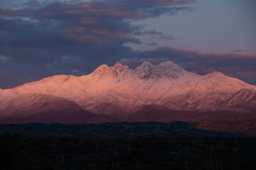 Snow covered mountains at sunset