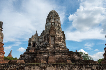 Fototapeta na wymiar Ayutthaya / Thailand / August 8, 2020 : Wat Ratchaburana, Ancient Buddhist temple remains with elaborate carvings & a restored tower & tomb.