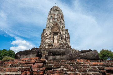 Fototapeta premium Ayutthaya / Thailand / August 8, 2020 : Wat Ratchaburana, Ancient Buddhist temple remains with elaborate carvings & a restored tower & tomb.