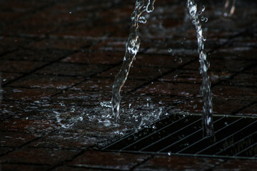 Naklejka na ściany i meble water flowing into a fountain