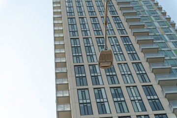 street light with apartment block in background