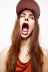 Woman with a cap Rolls his eyes wide open mouth on her head sexy 