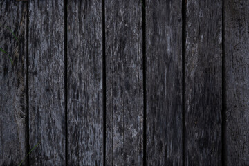 texture of an even row of old gray rotten boards