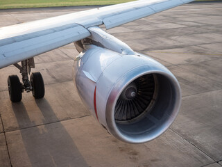 Aircraft jet engine turbine on ground. Aircraft parking during transit.