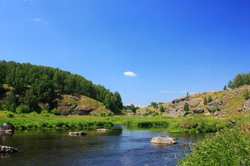 Fototapeta na wymiar Big boulders lying in the river