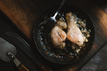 Roasted chicken with onion and garlic top view