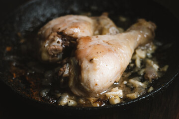Roasted chicken with onion and garlic closeup