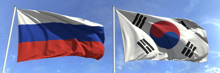 Flags of Russia and South Korea on flagpoles. 3d rendering