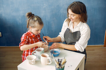 Master class for the child. Master make a dishes. Artist works with a clay. Ceramics theme.