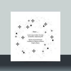 Simple Christmas card with small black snowflakes on white background.