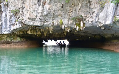 Rowboats Rowing Through Cave, Turquoise Water in Foreground, Lan Ha Bay, Vietnam
