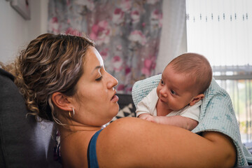 A Baby in its Mother's Arms