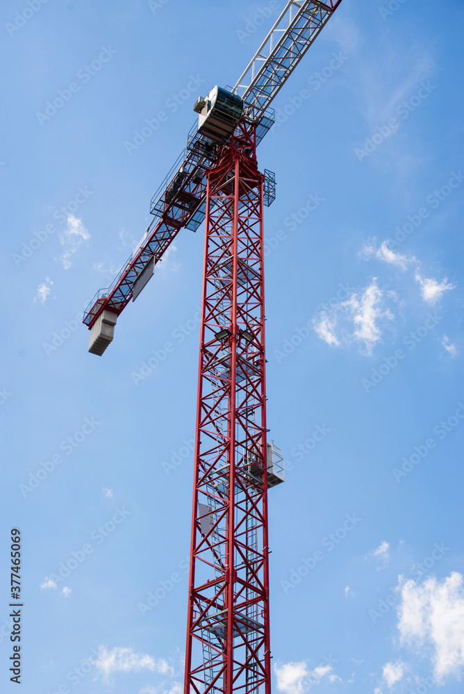 Wall mural crane on a blue sky