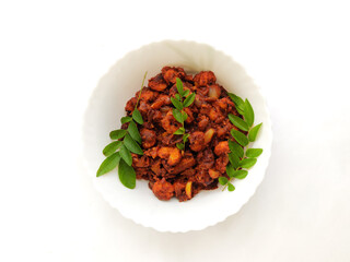 close up view of spicy prawns roast in a white  bowl at white background.