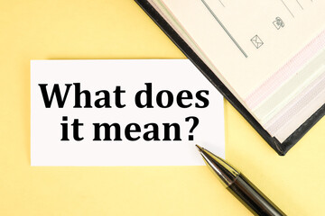 WHAT DOES THIS MEAN. TEXT ON WHITE PAPER ON YELLOW BACKGROUND