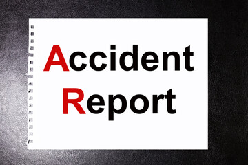 accident report. text on white paper on black background
