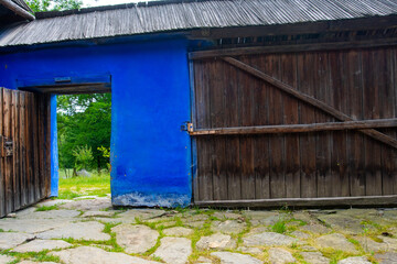 Fototapeta na wymiar wooden door and window of the traditional wooden and brick house in the authentic village