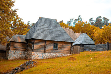 peasant house with thatched roof and tile built of clay and brick