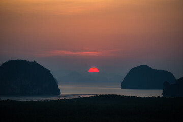 The Silhouette of the mountain Sunrise. at Samed nangshe thailand