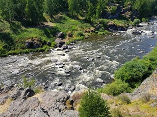 Large stones lie in a mountain river