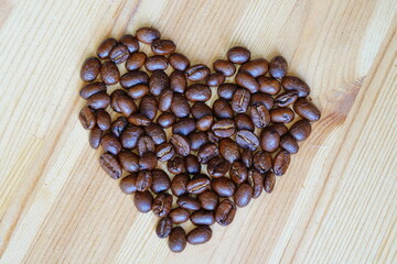 Heart shaped roasted coffee beans.