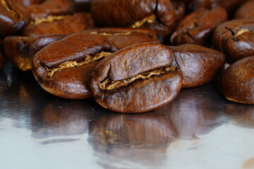 Coffee beans close-up on foil.