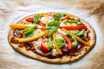 Margherita pizza on baking paper

