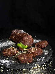 Sweet salami against black background