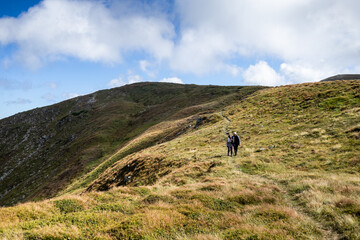 happy young couple traveling in the mountains