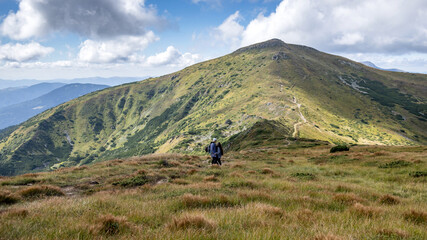 happy young couple traveling in the mountains