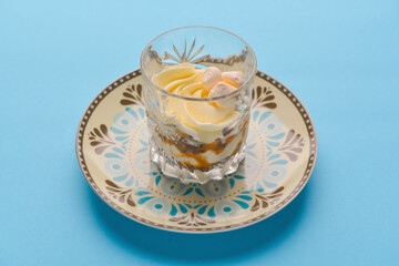 Layered light healthy cream dessert with chia seeds. Delicious dessert with fruit and yogurt.