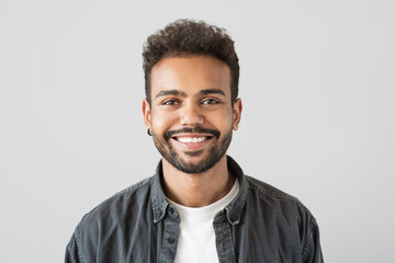 Handsome smiling young man portrait, Laughing joyful cheerful businessman studio shot, Isolated on...