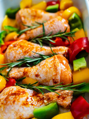 Marinated raw chicken drumsticks ready to roast
