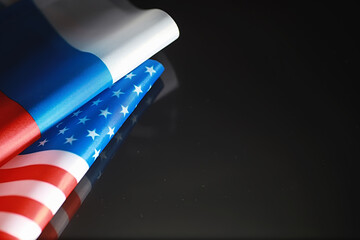 The concept of diplomatic relations. Flag of the United States of America and the Russian...