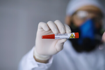 A scientist researcher in the laboratory is testing drugs for the treatment of viral pneumonia. Coronovirus blood test of infected patients. World pandemic.