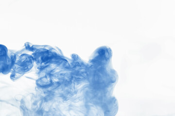 Puffs of paint in water. The dissolution of the dye in water. Water pollution. Concept art creativity.