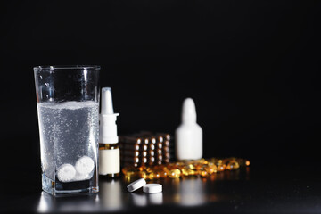 Composition from Bottles of cough syrup.Healthcare, medicine, flu and treatment concept - paper wipes and thermometer with pills.