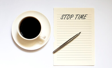 STOP TIME - white paper with pen and coffee on white background