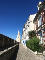 Street in La Rochelle with diminishing perspective and tower