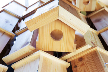 Wooden bird feeders. Wildlife care in an urban setting
